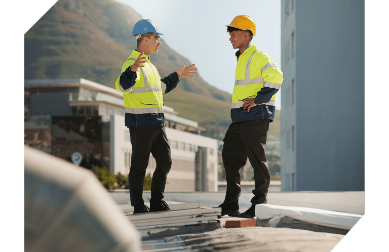 Two Roofers Talking on Roof